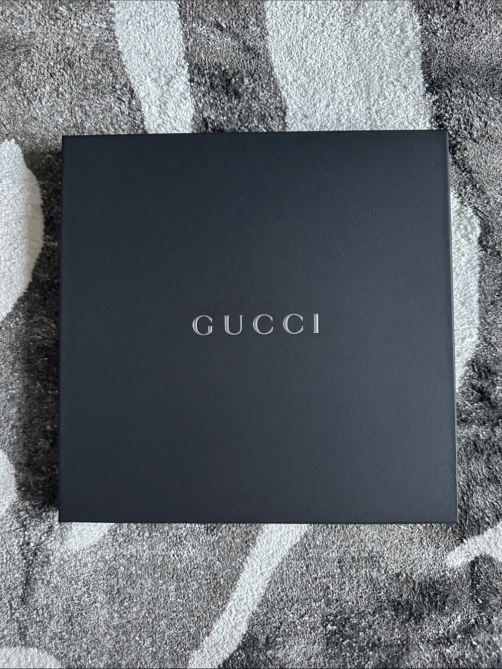 Black Gucci Box with Silver “GUCCI” Logo and tissue, 9.75” x 9.75”